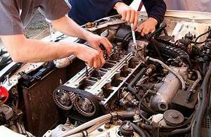 Mechanic working on an engine at Egan's Garage